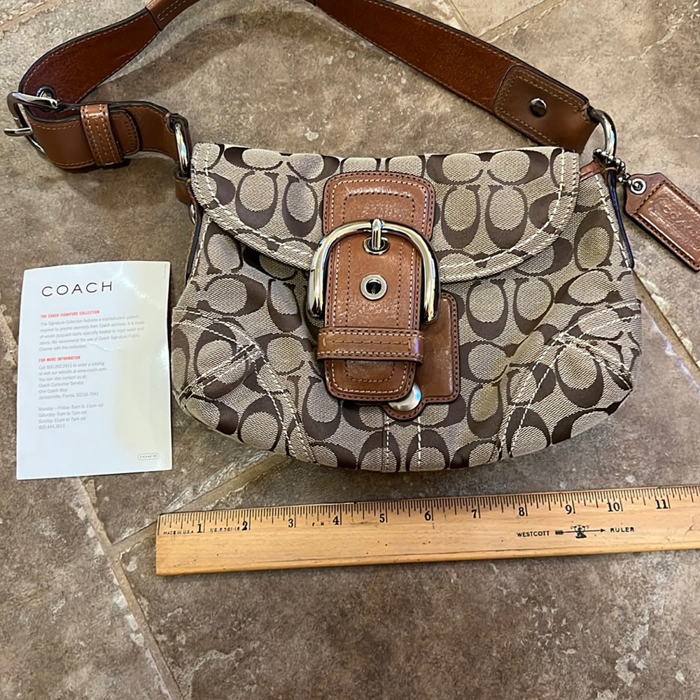 Good used condition small coach pocketbook.